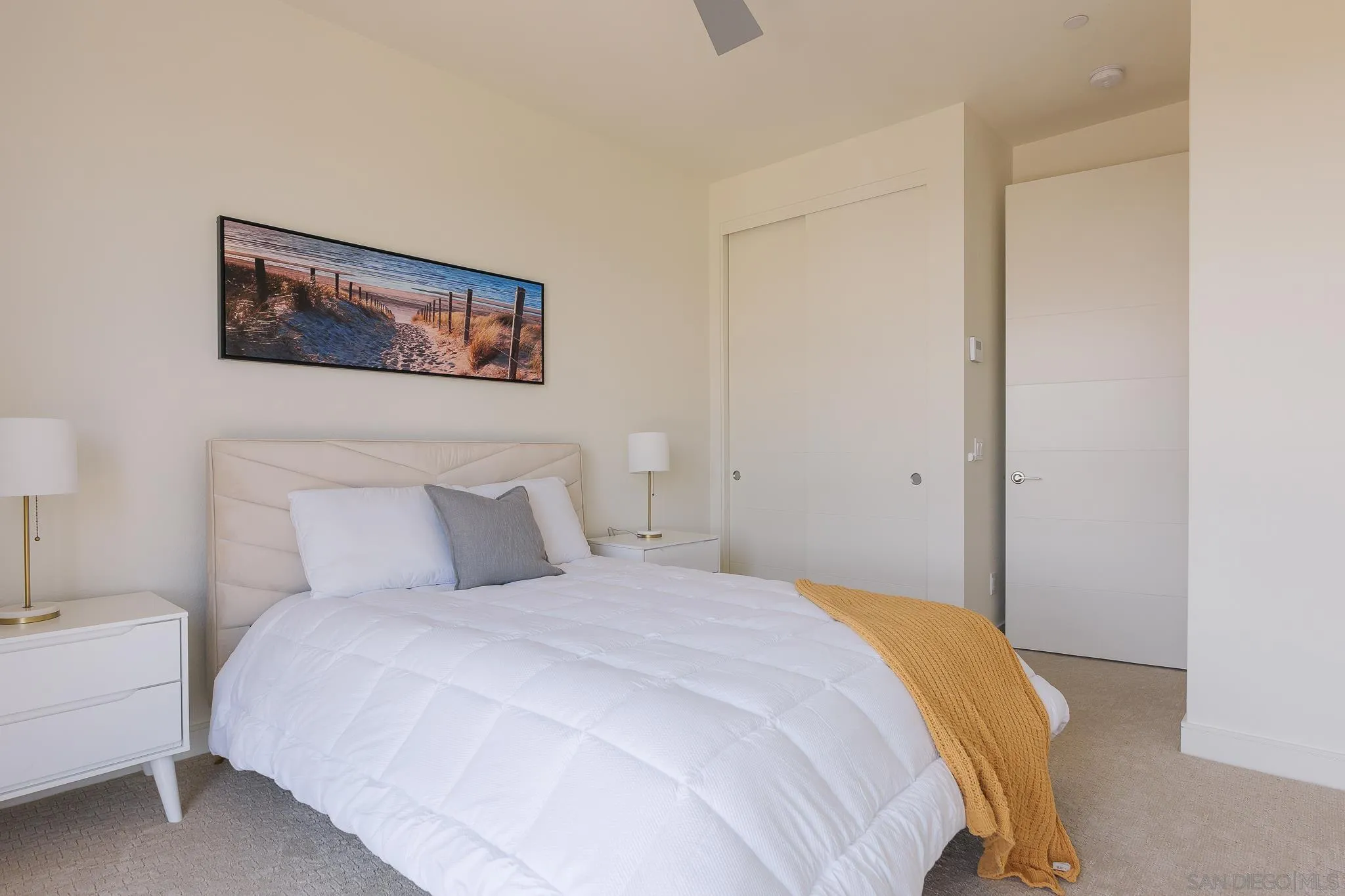 8252 High Street La Mesa, CA 91941 - Photo 13 of 23 a bedroom with a bed and a couch