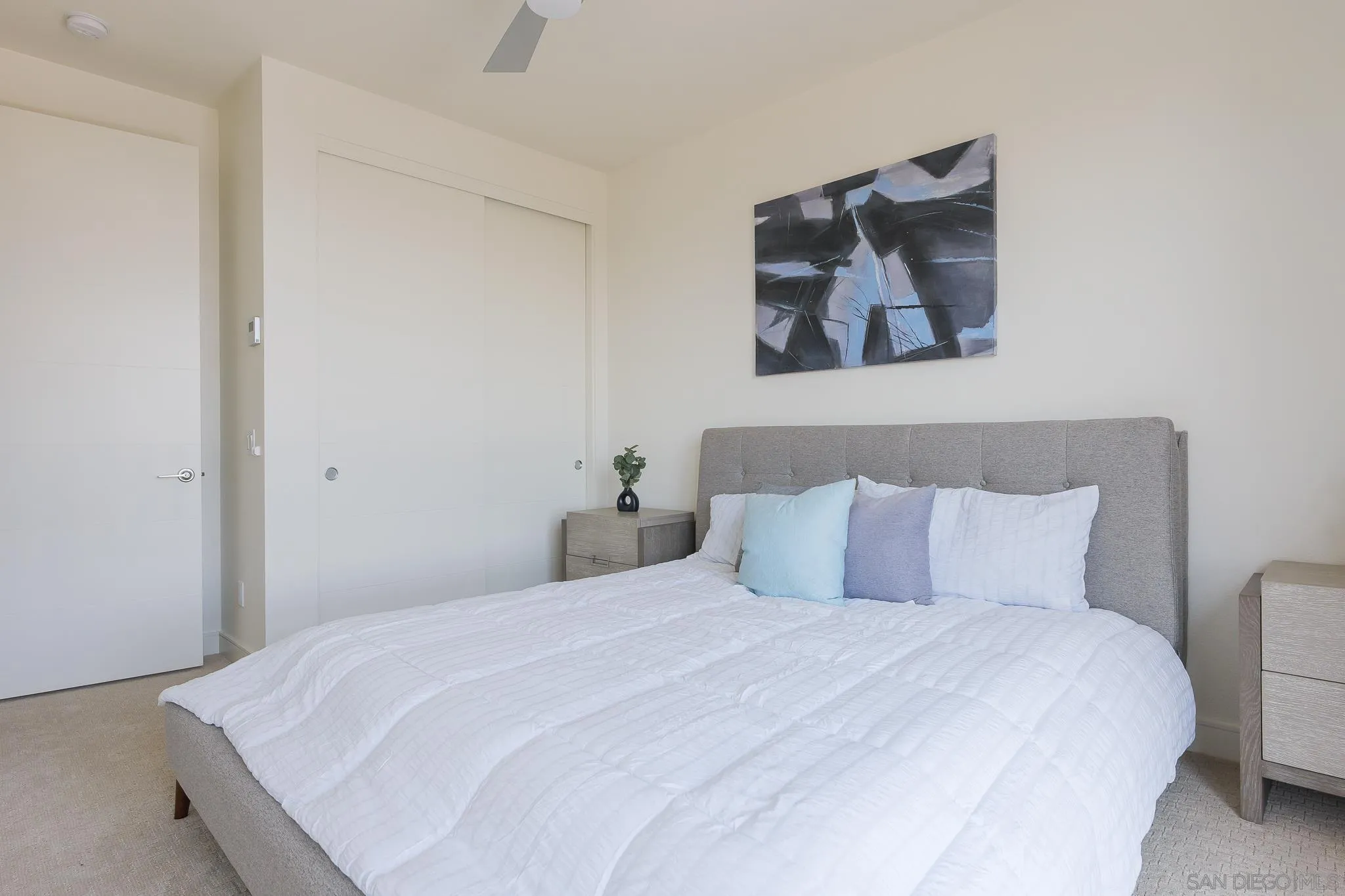 8252 High Street La Mesa, CA 91941 - Photo 17 of 23 a bedroom with a bed and painting on the wall