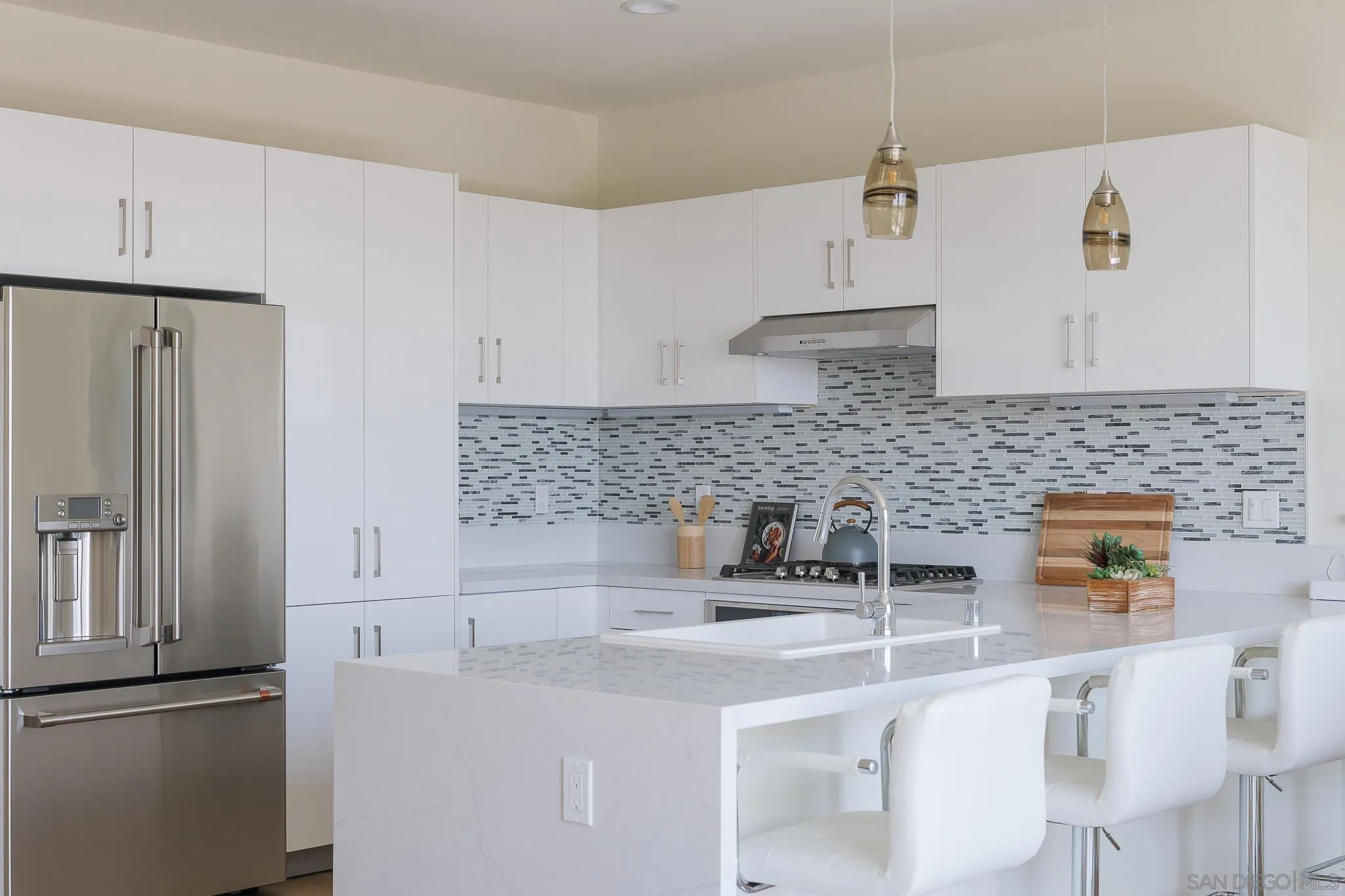8252 High Street La Mesa, CA 91941 - Photo 5 of 23 a kitchen with stainless steel appliances granite countertop a sink a stove a refrigerator and cabinets