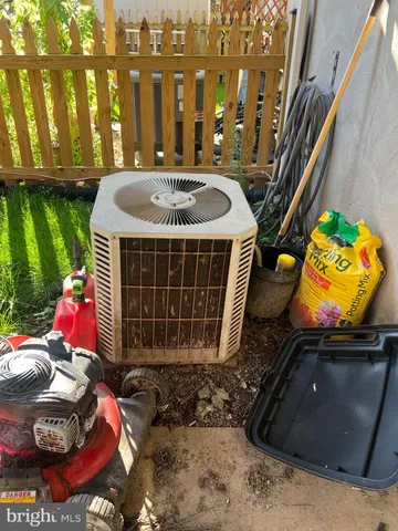 a front view of a house with outdoor seating