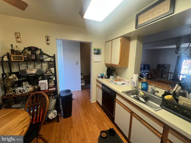 a kitchen with a sink appliances and cabinets