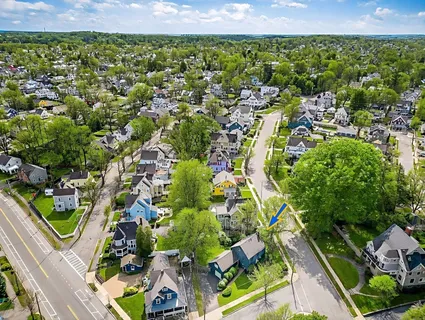 an aerial view of residential houses with outdoor space