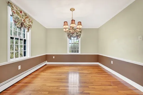 a view of a room with window and chandelier