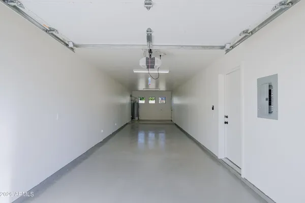 a large kitchen with cabinets wooden floor and stainless steel appliances