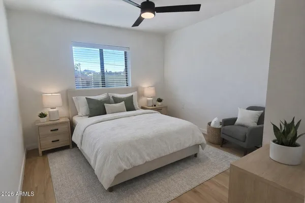 a bedroom with a bed and window