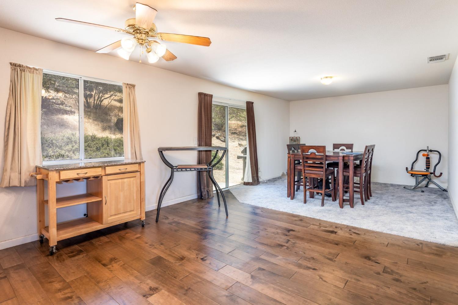 43142 Ellen Mine Road Coarsegold, CA 93614 - Photo 11 of 29 a view of a dining room with furniture window and wooden floor