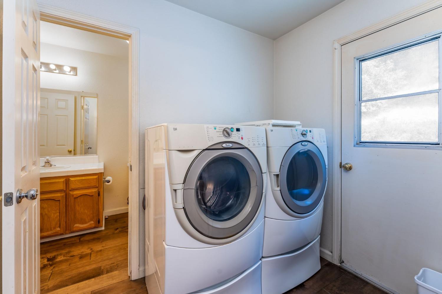 43142 Ellen Mine Road Coarsegold, CA 93614 - Photo 17 of 29 a utility room with dryer and washer