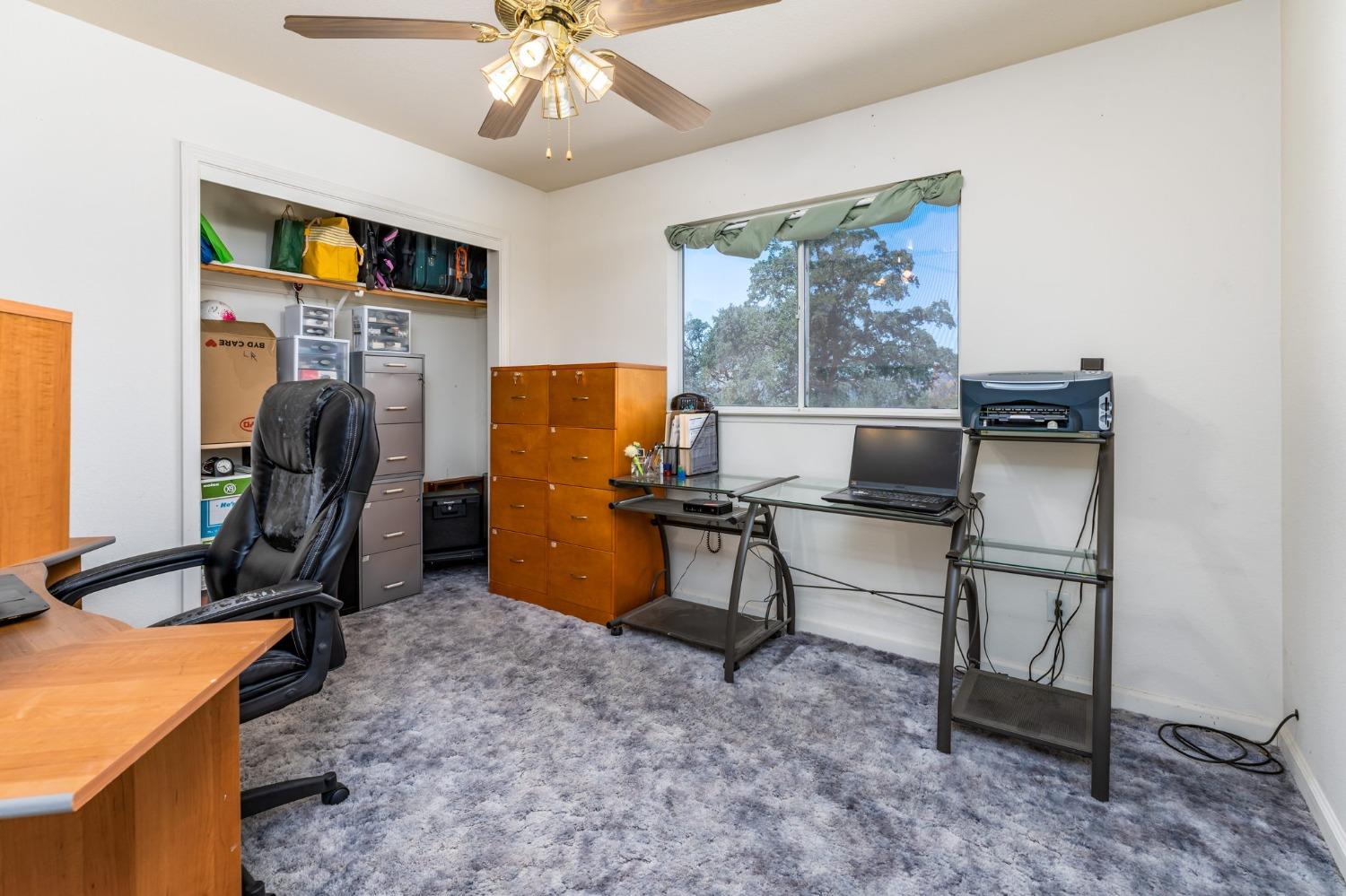 43142 Ellen Mine Road Coarsegold, CA 93614 - Photo 19 of 29 a view of a workspace with furniture