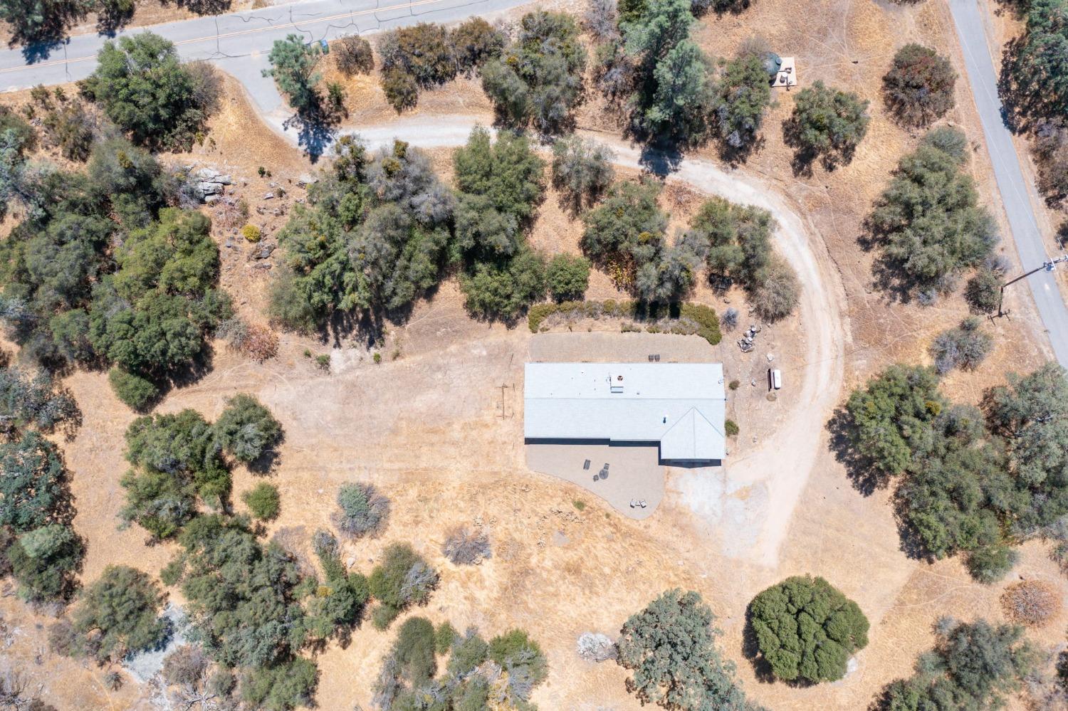 43142 Ellen Mine Road Coarsegold, CA 93614 - Photo 3 of 29 an aerial view of a house with yard and lake view