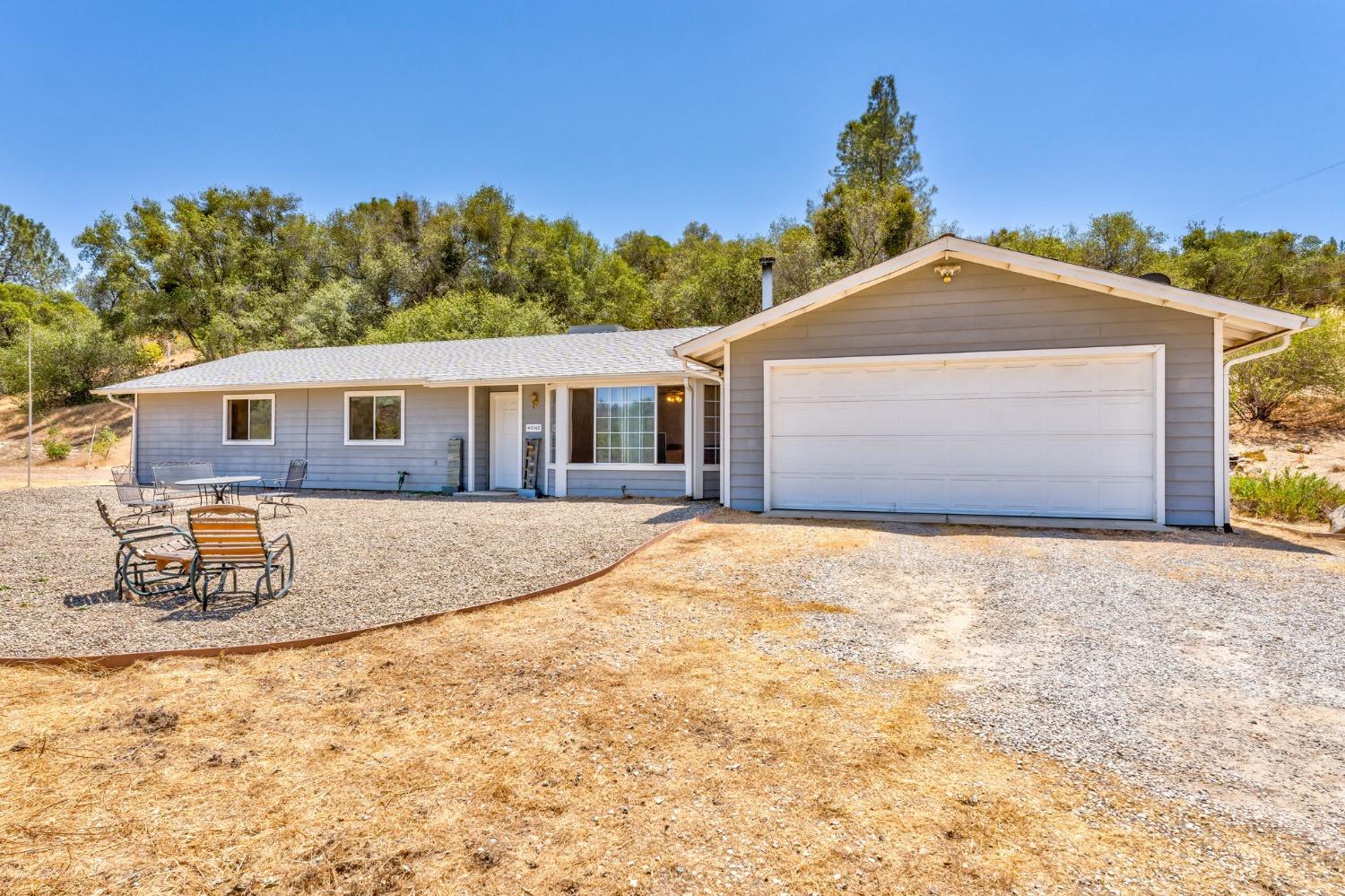 43142 Ellen Mine Road Coarsegold, CA 93614 - Photo 5 of 29 a front view of a house with a yard