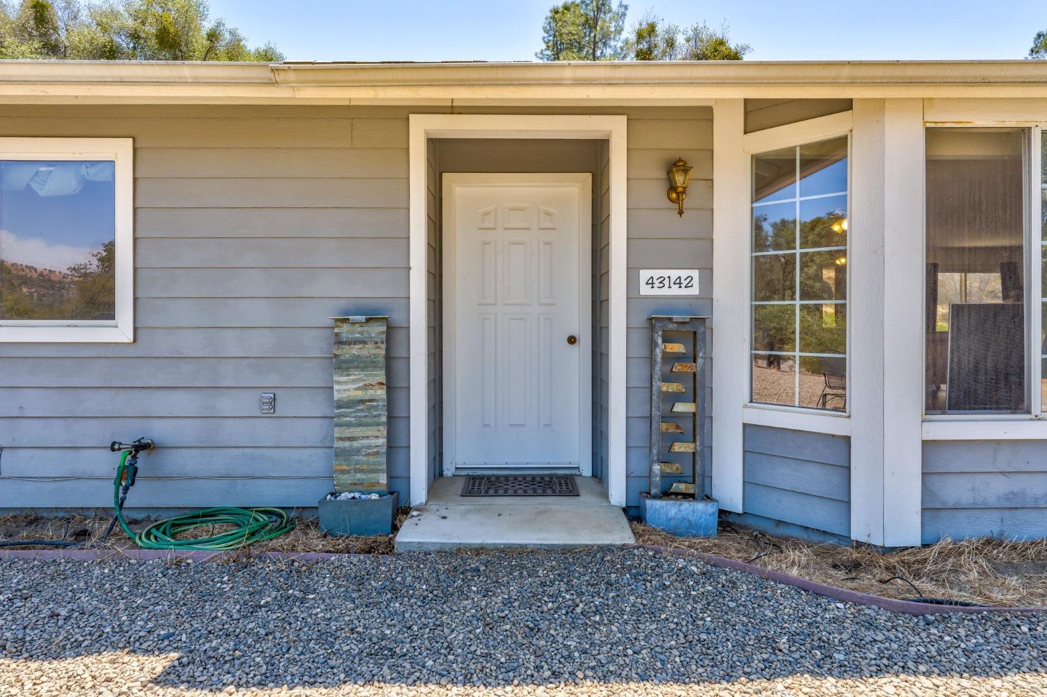 43142 Ellen Mine Road Coarsegold, CA 93614 - Photo 6 of 29 a front view of a house with a yard