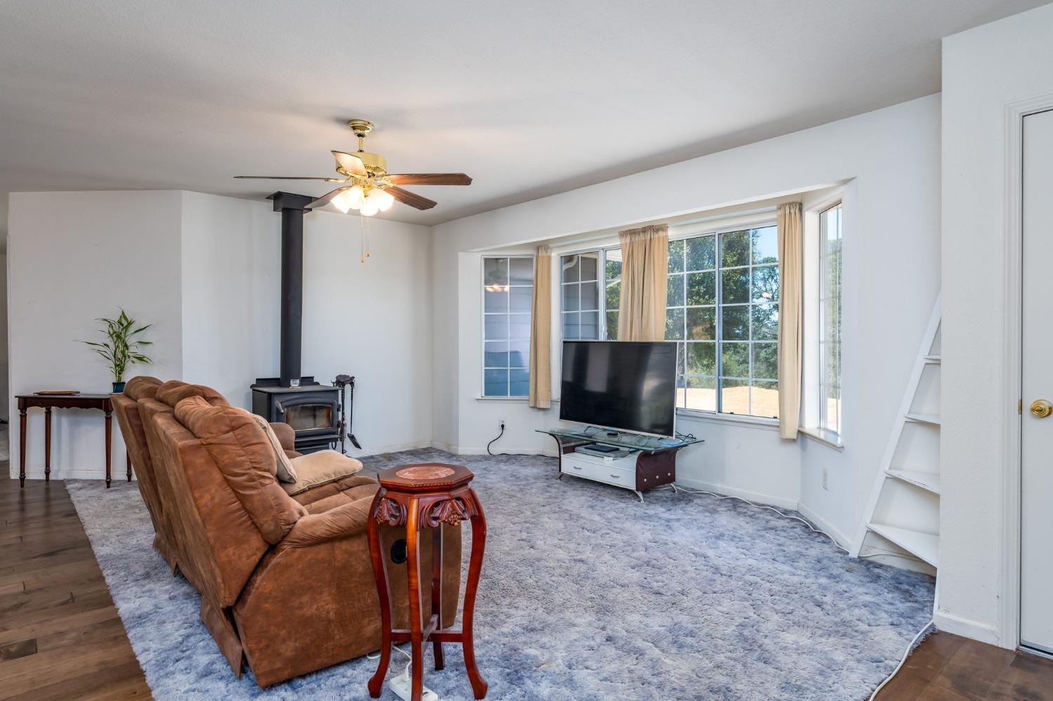 43142 Ellen Mine Road Coarsegold, CA 93614 - Photo 8 of 29 a living room with furniture and a flat screen tv