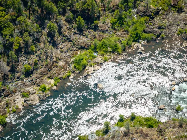 a backyard of a house with a yard with outdoor seating