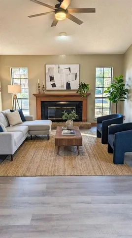 a living room with furniture and a fireplace