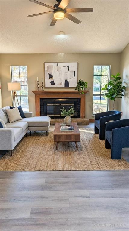 2204 Crestmeadow Street Denton, TX 76207 - Photo 11 of 21 a living room with furniture and a fireplace