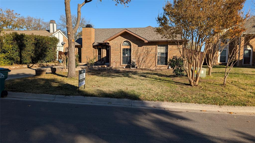 2204 Crestmeadow Street Denton, TX 76207 - Photo 21 of 21 a view of a house with a yard