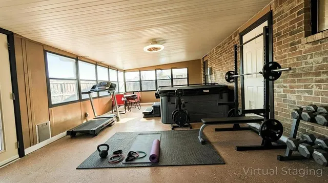 a room with gym equipment and a large window