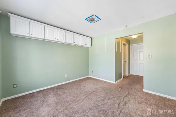 a view of a kitchen with cabinets