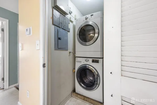 a view of a hallway with washer and dryer