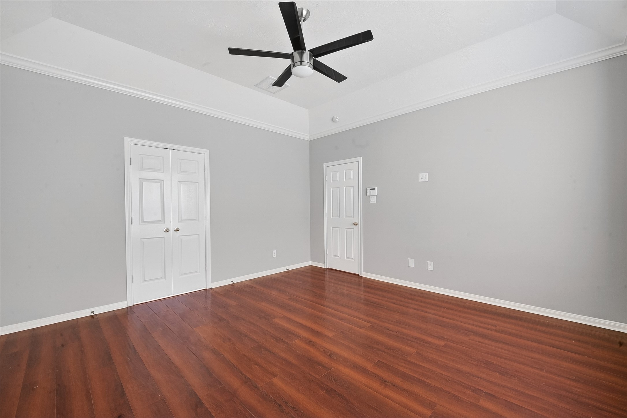 14308 Rocky Briar Lane Rosharon, TX 77583 - Photo 27 of 46 a view of a room with wooden floor and a ceiling fan