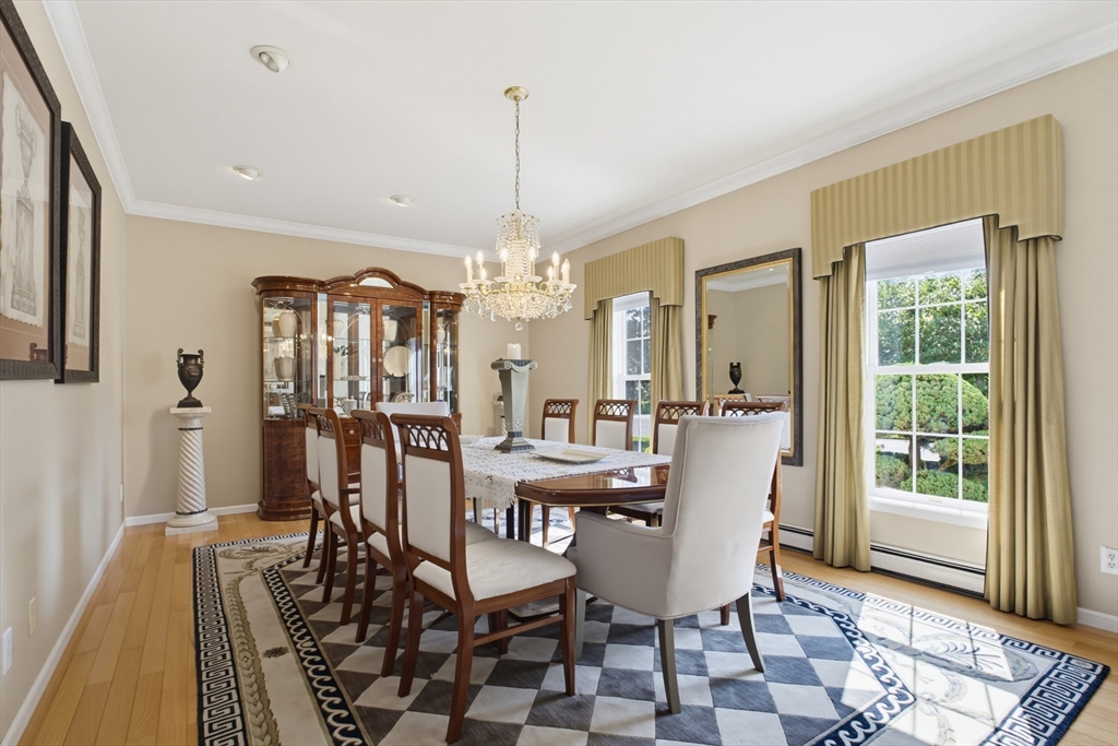 226 Olympic Road Somerset, MA 02726 - Photo 10 of 42 a view of a dining room with furniture and a chandelier