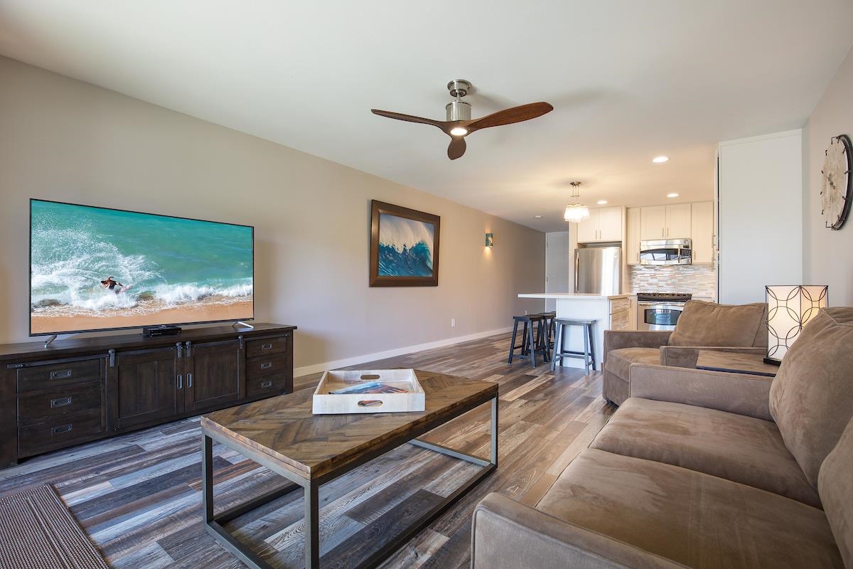 2737 South Kihei Road, Unit 126 Kihei, HI 96753 - Photo 11 of 25 a living room with furniture and a flat screen tv