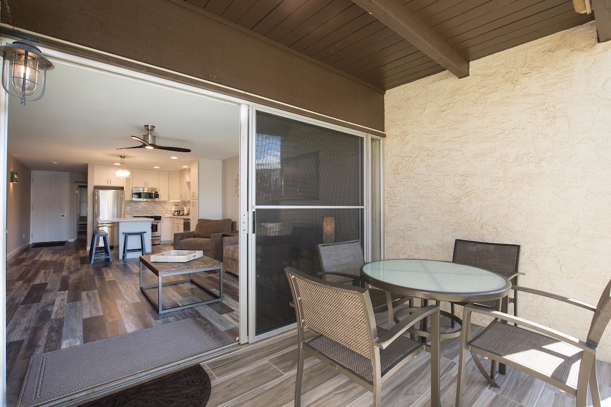 2737 South Kihei Road, Unit 126 Kihei, HI 96753 - Photo 17 of 25 a view of a dining room with furniture and wooden floor