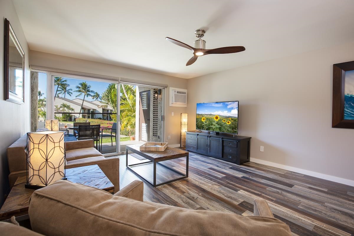 2737 South Kihei Road, Unit 126 Kihei, HI 96753 - Photo 10 of 25 a living room with furniture and a flat screen tv