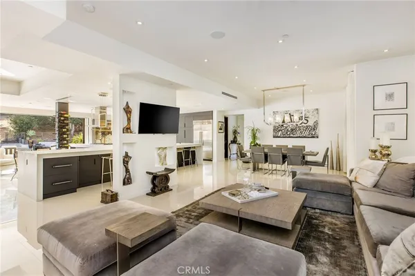 a living room with fireplace furniture and a flat screen tv