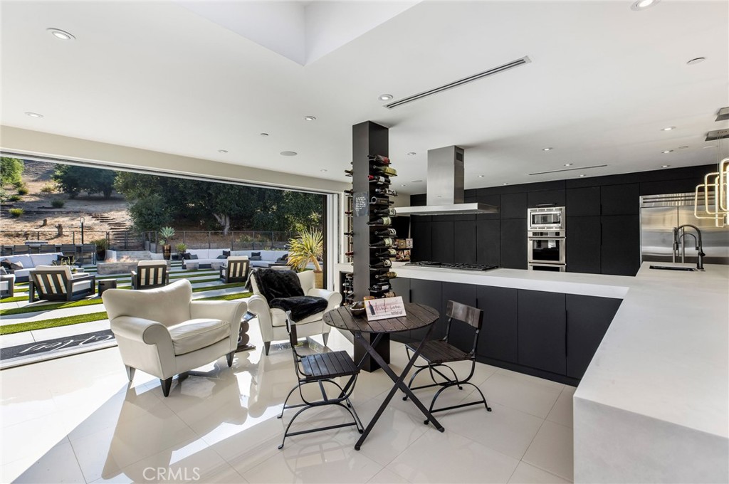 207 Saddlebow Road Bell Canyon, CA 91307 - Photo 9 of 33 a living room with lots of furniture and view of kitchen