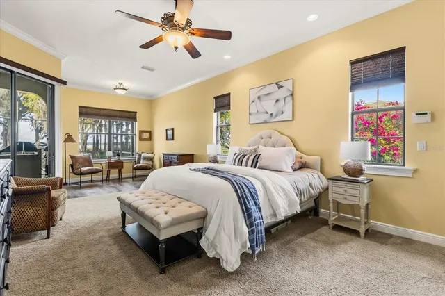 a bedroom with two beds and a large window