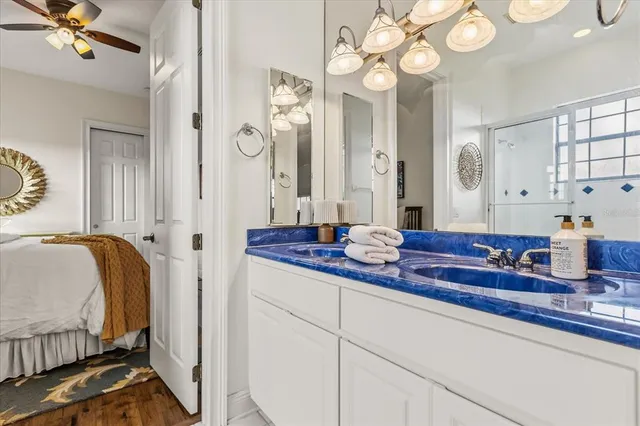 a bathroom with a toilet a sink and a mirror
