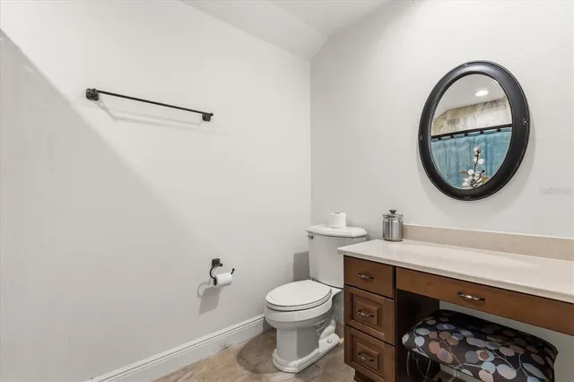 a view of a white house with a yard