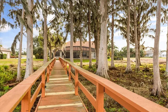 an aerial view of a residential houses with outdoor space