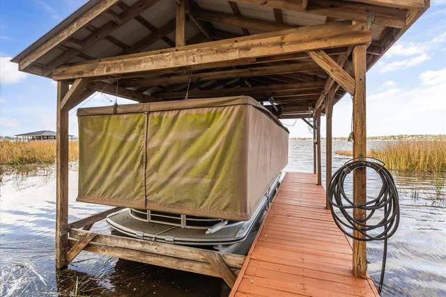 an aerial view of a residential houses with outdoor space
