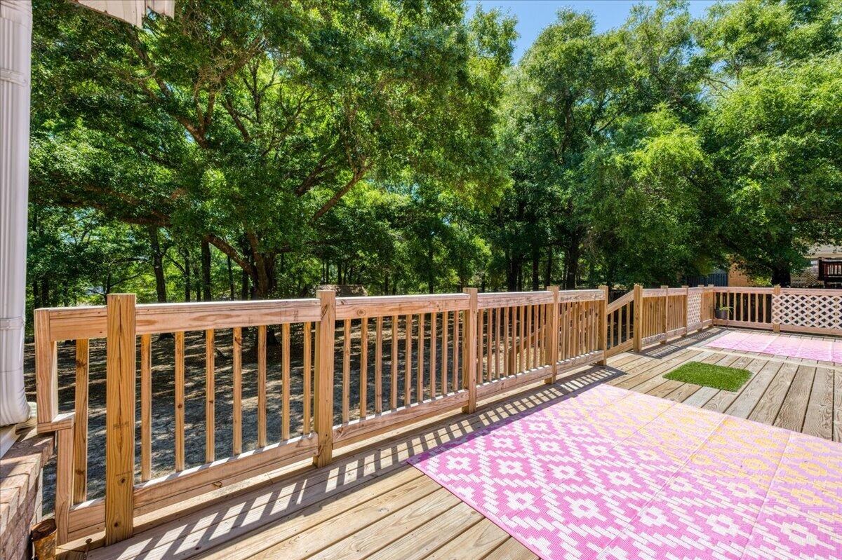 210 Shell Drive Crestview, FL 32536 - Photo 57 of 67 a view of balcony with wooden floor and fence