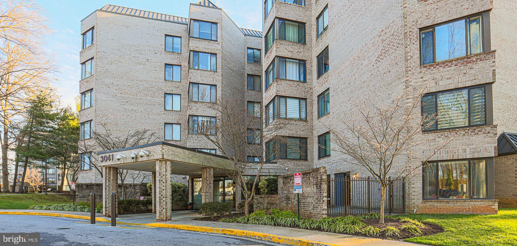 3041 Fallstaff Road, Unit 304D Baltimore, MD 21209 - Photo 1 of 39 a view of a building with a yard