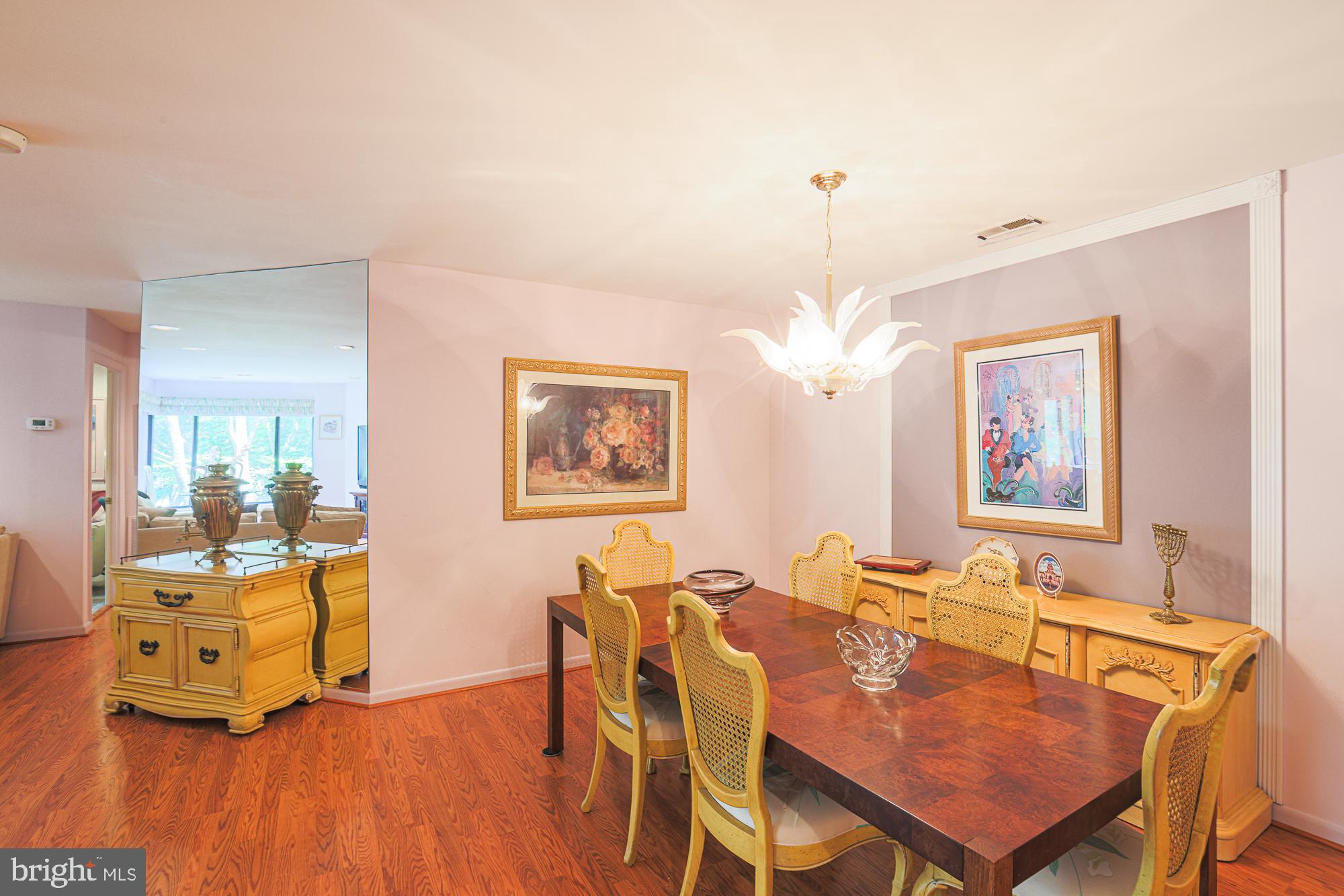3041 Fallstaff Road, Unit 304D Baltimore, MD 21209 - Photo 12 of 39 a dining room with furniture and chandelier
