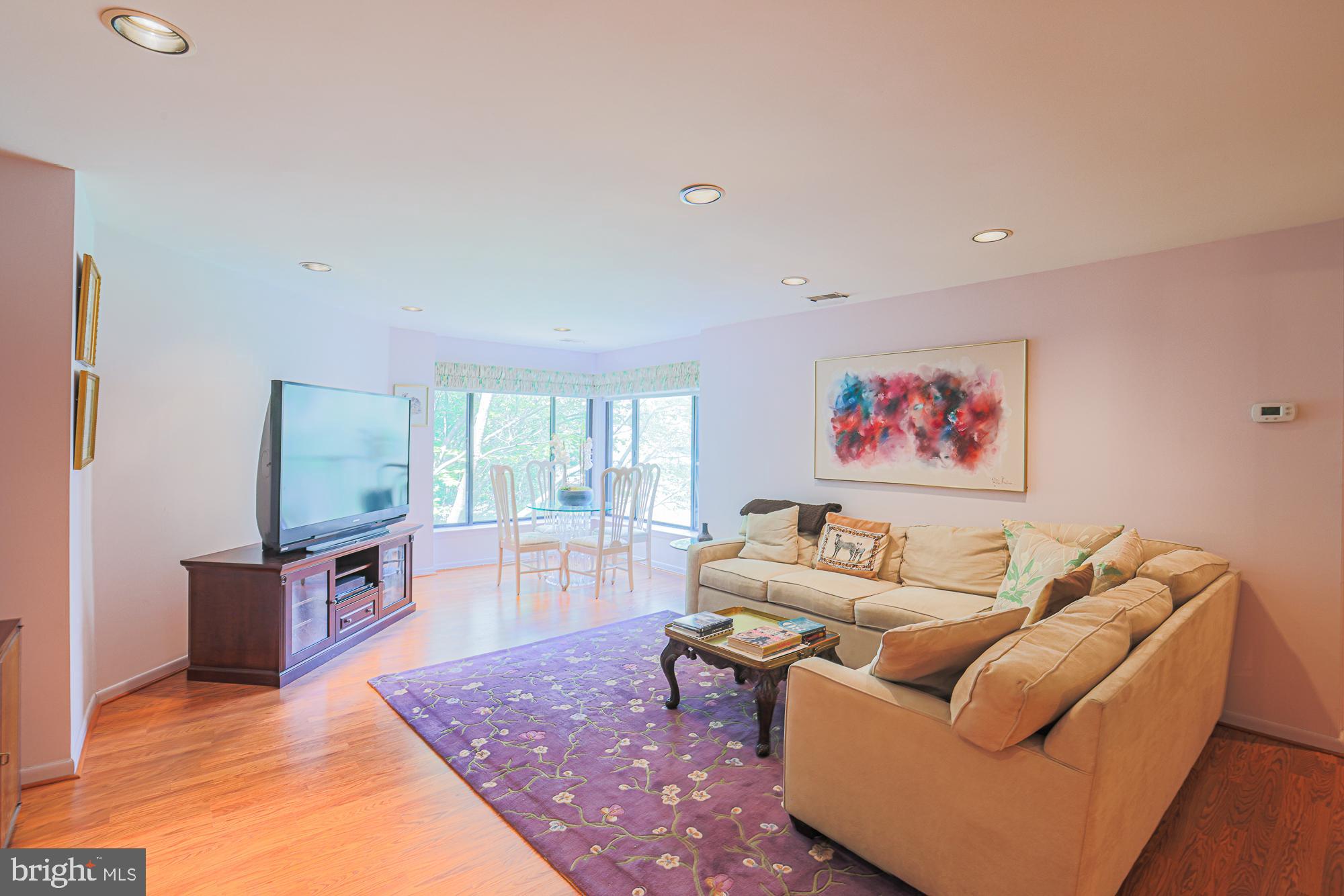 3041 Fallstaff Road, Unit 304D Baltimore, MD 21209 - Photo 14 of 39 a living room with furniture and a flat screen tv