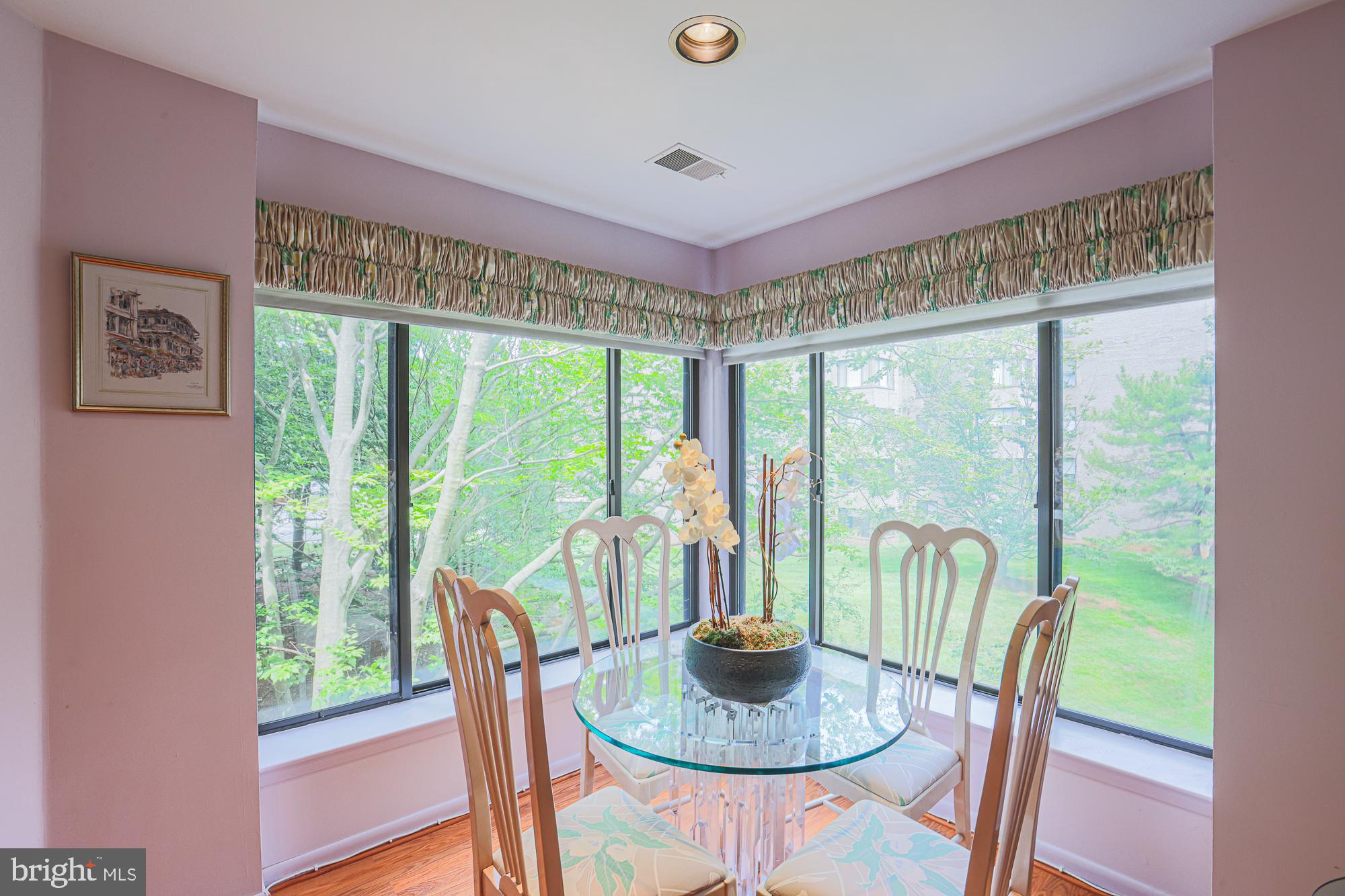 3041 Fallstaff Road, Unit 304D Baltimore, MD 21209 - Photo 16 of 39 a dining room with furniture a rug and a large window