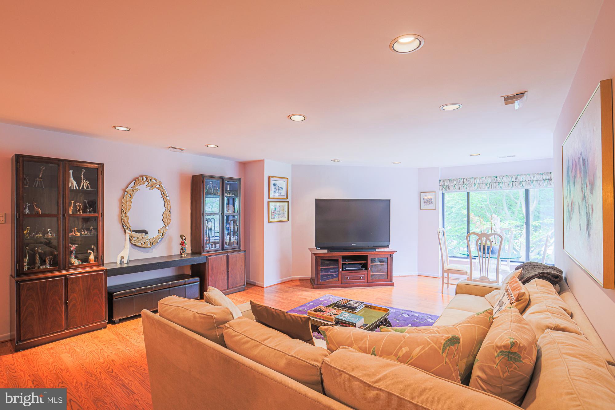 3041 Fallstaff Road, Unit 304D Baltimore, MD 21209 - Photo 19 of 39 a living room with furniture and a flat screen tv
