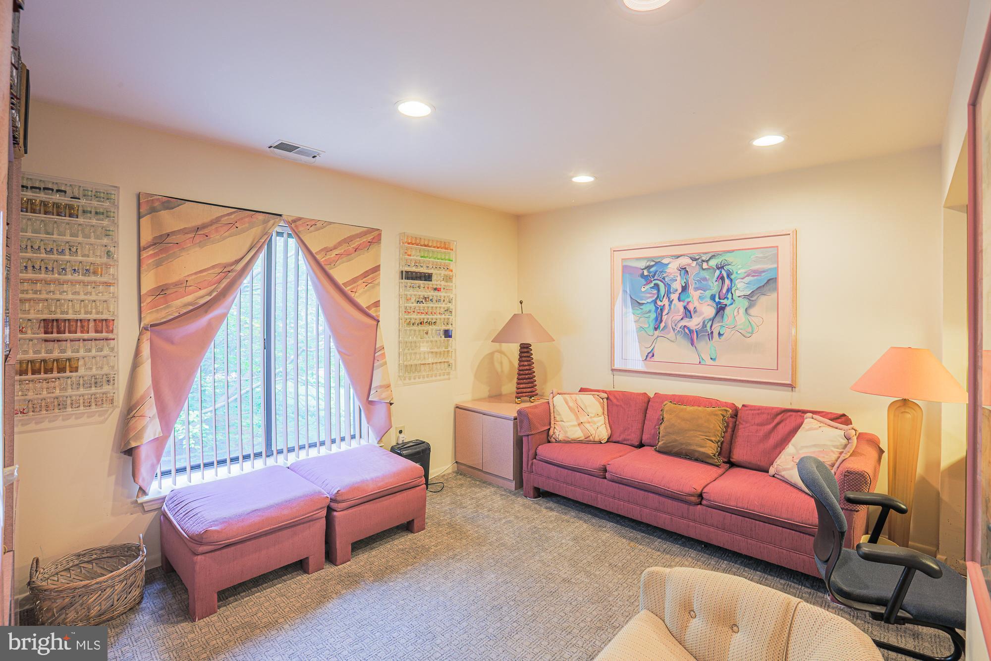 3041 Fallstaff Road, Unit 304D Baltimore, MD 21209 - Photo 21 of 39 a living room with furniture and a large window