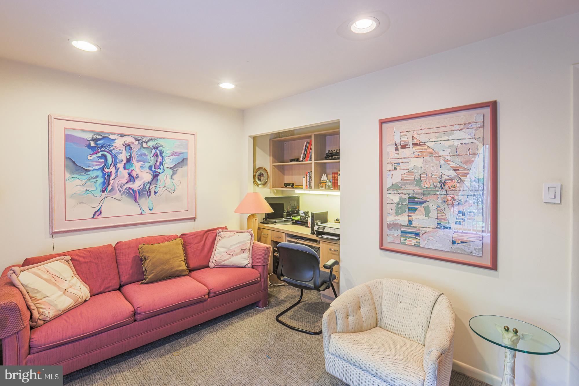 3041 Fallstaff Road, Unit 304D Baltimore, MD 21209 - Photo 22 of 39 a living room with furniture a couch and a wall painting