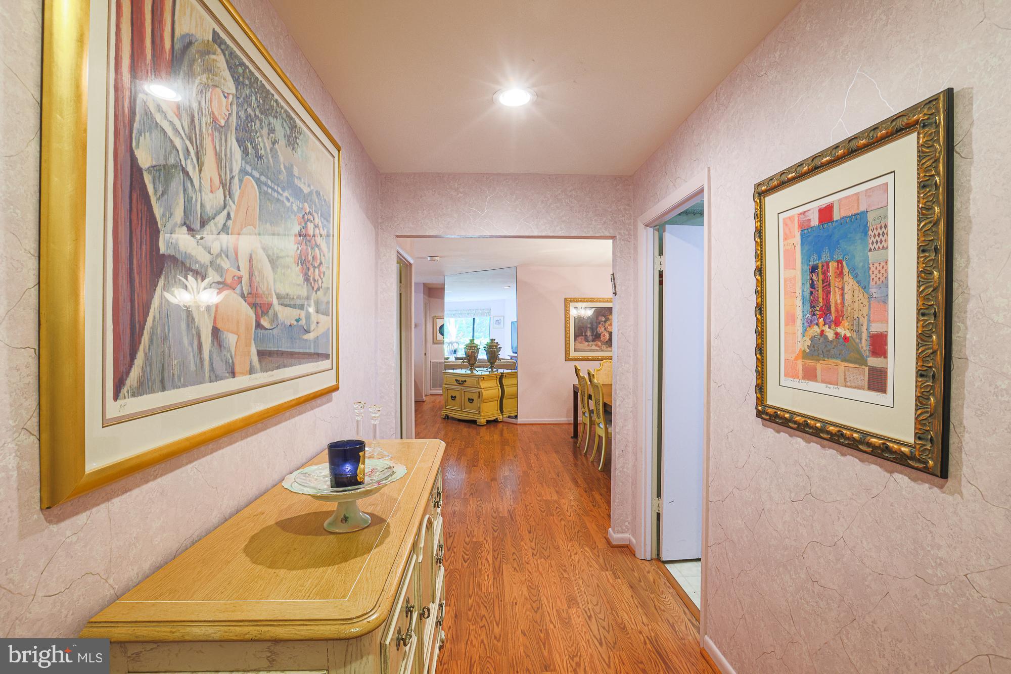 3041 Fallstaff Road, Unit 304D Baltimore, MD 21209 - Photo 7 of 39 a view of a hallway with furniture and wooden floor