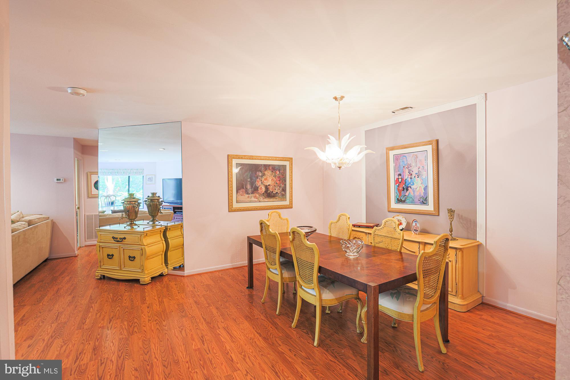 3041 Fallstaff Road, Unit 304D Baltimore, MD 21209 - Photo 8 of 39 a view of a dining room with furniture and wooden floor