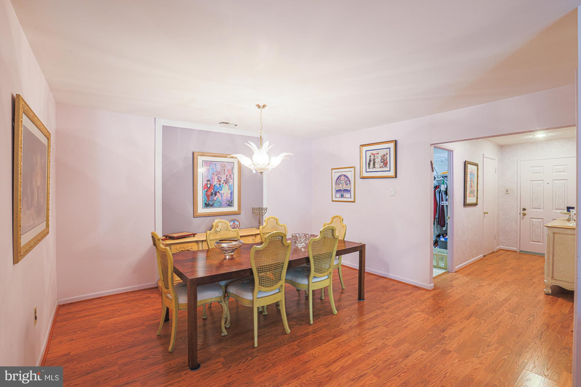 3041 Fallstaff Road, Unit 304D Baltimore, MD 21209 - Photo 9 of 39 a view of a dining room with furniture and wooden floor