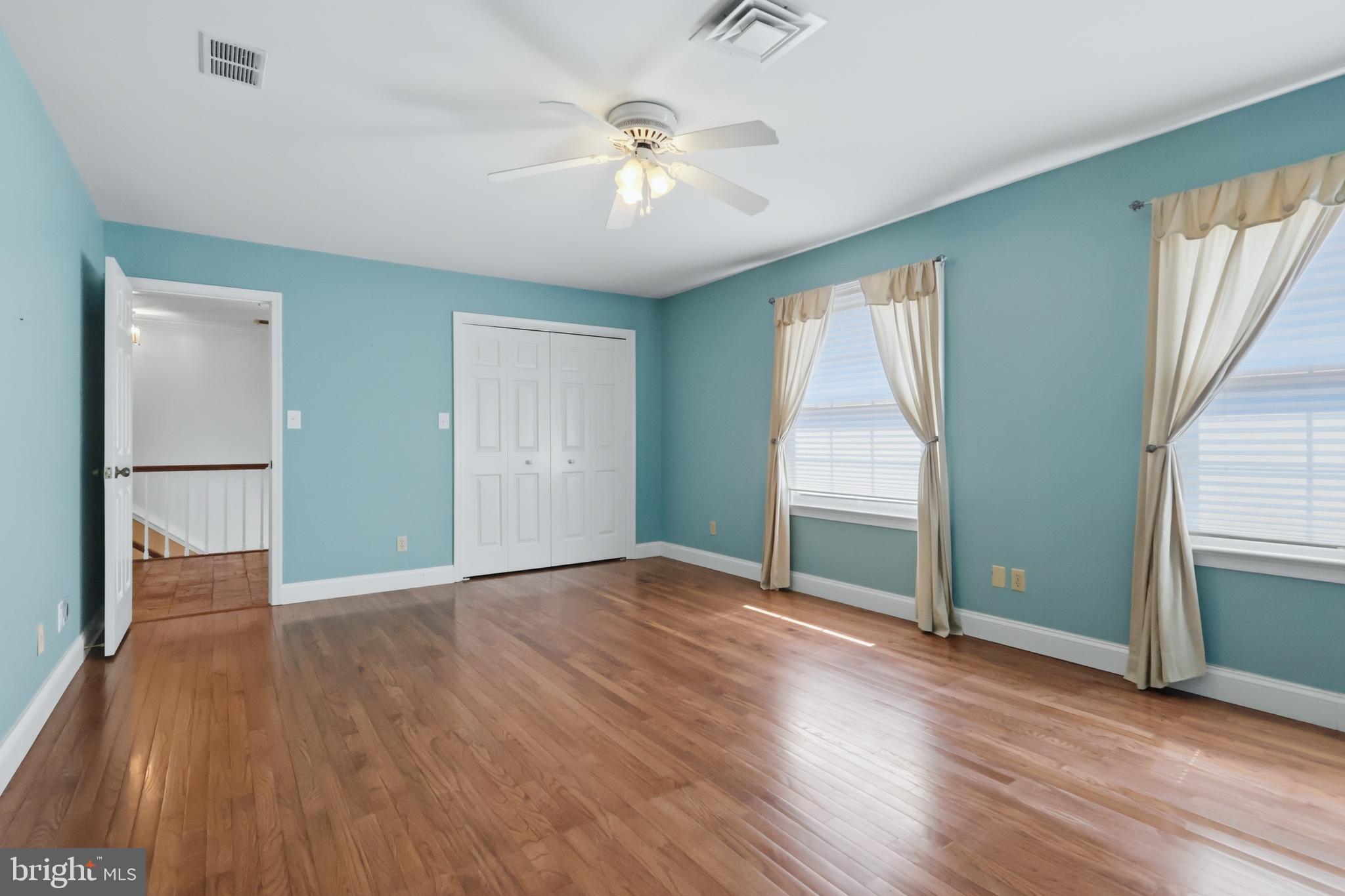 23500 River Road Lexington Park, MD 20653 - Photo 57 of 92 an empty room with wooden floor fan and windows