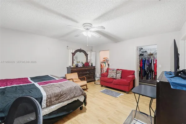 a bedroom with a bed and a couch