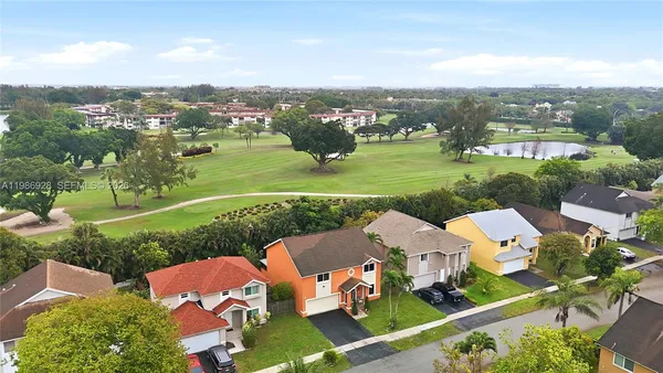 an aerial view of a house with a garden