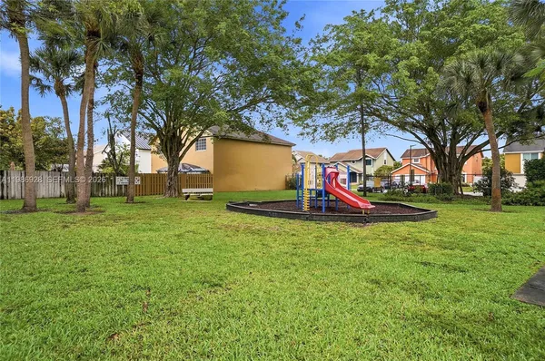 a view of a park with large trees